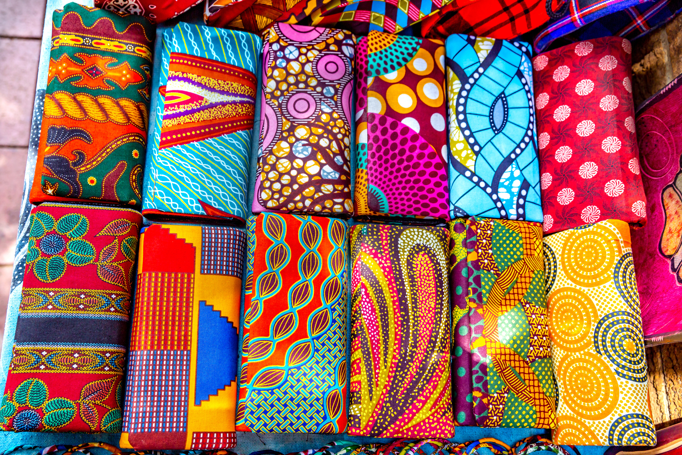 Colorful African cloths in street market, Africa
