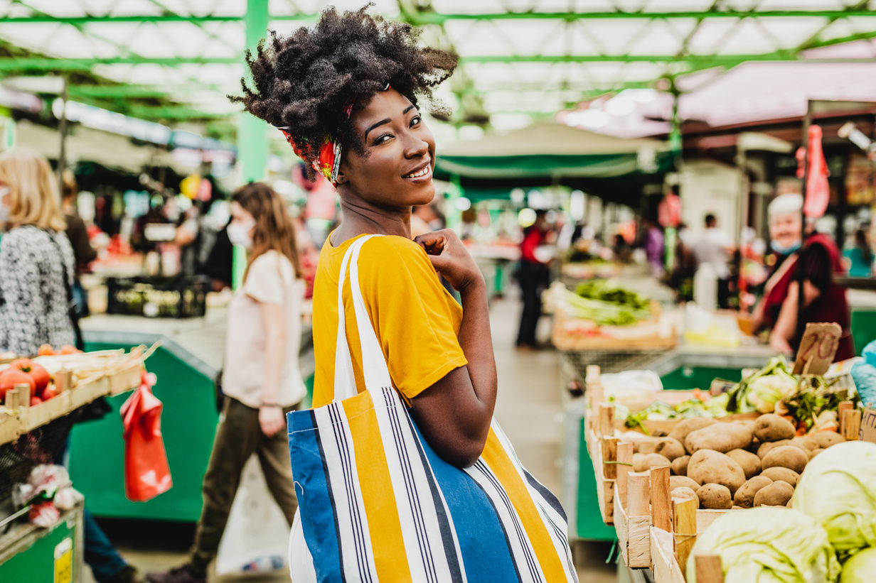Young African woman on a farmers market